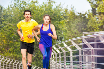 Sporty people running during outdoor workout