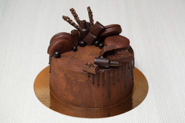 Chocolate cake with chocolate decoration, chocolate ganache