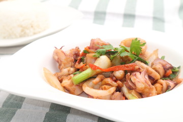 noddle tom yum seafood in white plate