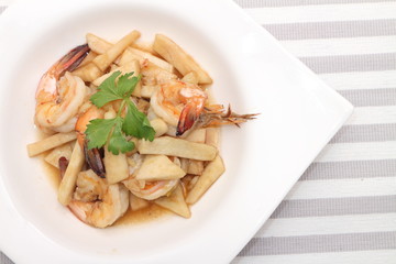 noddle tom yum seafood in white plate