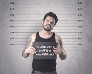 Caught gangster in jail with table on his hand.