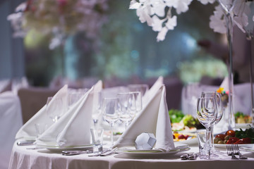 A Grand restaurant and a ballroom in a luxury hotel. The interior design is executed in classical style.