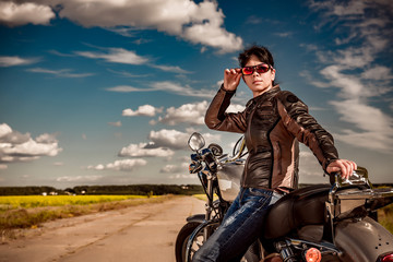 Obraz premium Biker girl on a motorcycle