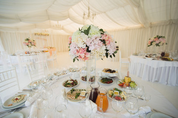 Beautiful Banquet hall under a tent for a wedding reception.