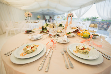 Beautiful Banquet hall under a tent for a wedding reception.