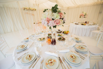 Beautiful Banquet hall under a tent for a wedding reception.