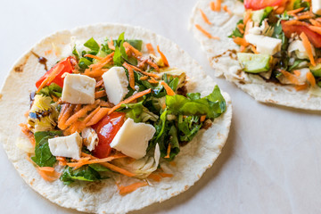 Homemade Vegetarian Tostadas with Salad, Cheese and Grated Carrot Slices