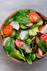 Fresh salad with baby spinach and tomato, radish und salad.