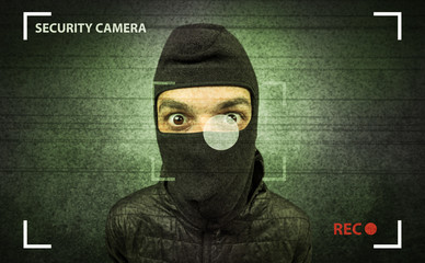 Caught burglar by house camera in action.