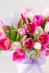 Pink tulip on the white background. Easter background