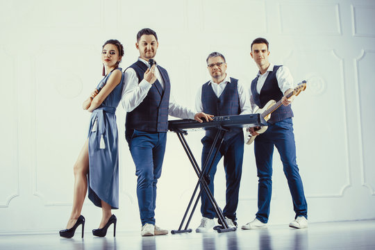 Music band performing in a studio