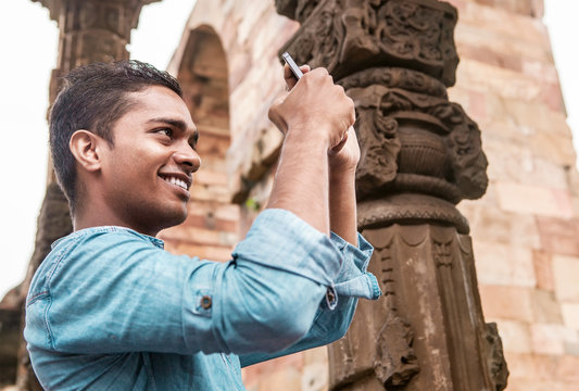 Indian young man take a mobil photo