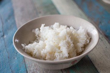 steam rice on wooden table 