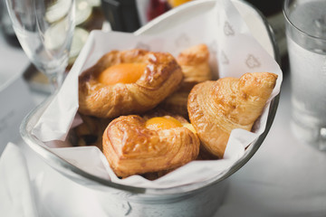 Eggs baked in a bun. French breakfast. Appetizing bruschetta with egg.