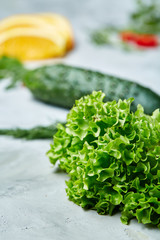 Fresh vegetables still life. Veges lined up on a white background, top view, close-up, selective focus, copy space.