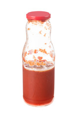Stale tomato juice in a glass bottle.