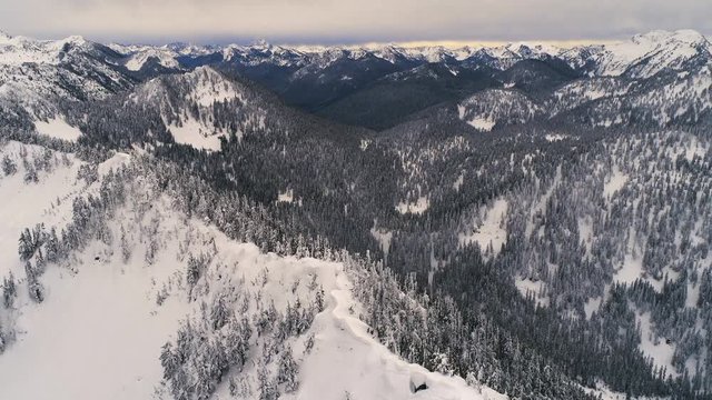 Snowy Ridge Aerial of Vast Mountain Range Background