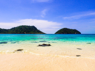 White sand beach and blue sea with clear sky in sunny summer day for holiday or vacation concept,Thailand.
