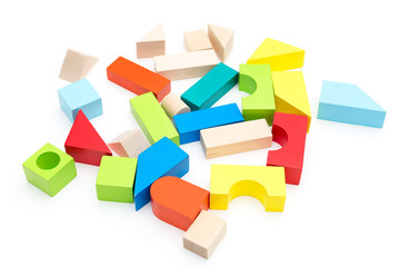 Children's wooden toy blocks on a white background. Isolated