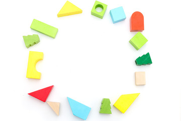 Children's educational wooden toys on a white background. Copy space