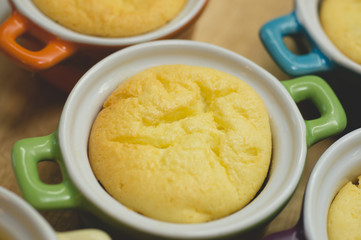 Cottage cheese casserole in colored ceramic forms in the form of pans. kid's food