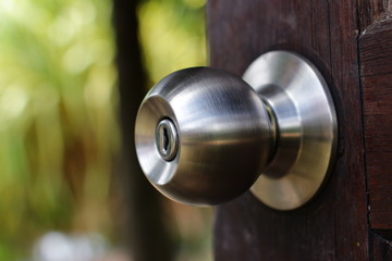 Doorknob silver stick blacked beautiful brown wooden door
