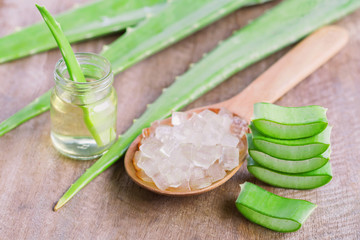 fresh aloe vera leaf with sliced and gel product on wood