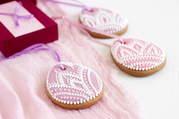 Homemade gingerbread Easter lilac and pink color in the form of egg with a floral pattern.