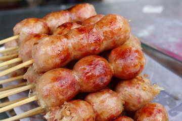 Deep fried sausages of fermented pork and glutinous rice northeastern Sai Krok Isaan Thai food