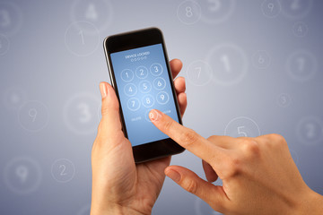 Female fingers touching smartphone with locked device requiring passcode