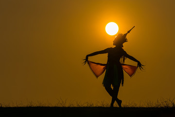Manora dance (or Nora dance) silhouette with sun - obrazy, fototapety, plakaty