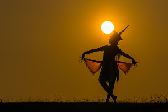 Manora dance (or Nora dance) silhouette with sun
