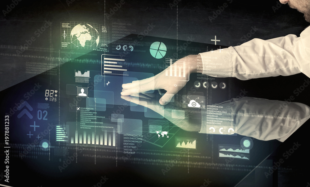 Poster businessman touching interactive modern desk with technology icons on table