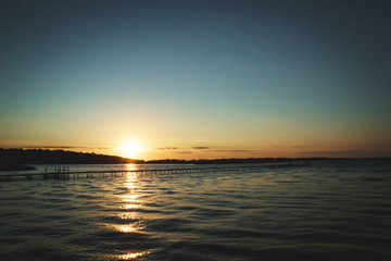 dock on the river at sunset