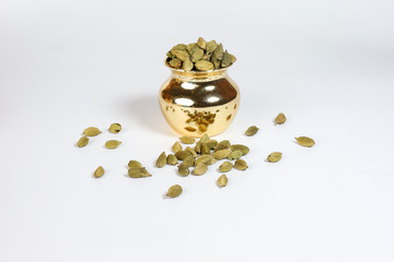 Cardamom  spice in shiny metal pot
