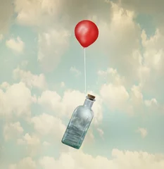 Papier Peint photo Lavable Surréalisme Image surréaliste représentant une bouteille en verre avec une mer agitée à l& 39 intérieur portée par un ballon rouge volant dans les nuages