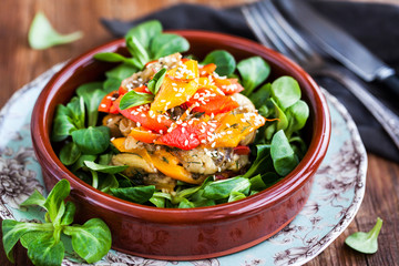 Delicious fresh warm eggplants, bell pepper and sesam salad