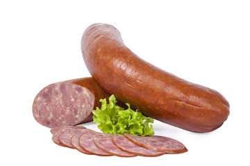 Boiled smoked sausage whole and partially sliced. Isolated on white background