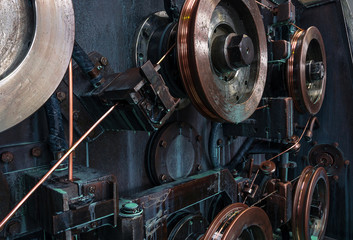 Copper round rollers for rolling wire. Fragment Wire drawing equipment. Abstract industrial background.