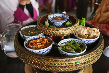 Asian dish made of rice and mixed variety of vegetables, tofu, tempeh, fritters and sauces, asian Indonesian cuisine, food culture, spicy