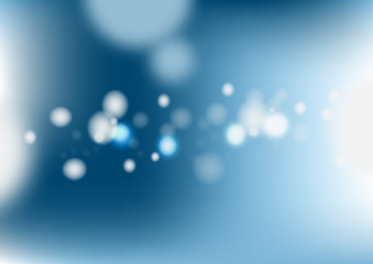 Abstract blurred blue background with light bokeh.