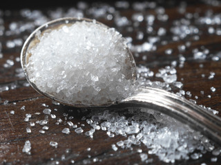 Sugar on a spoon close-up, macro photo.