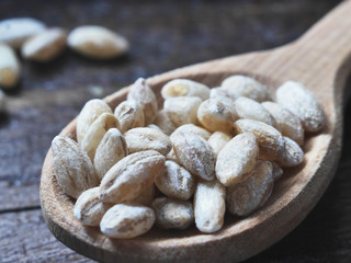Croup of oats close-up on a dark wooden background, macro photo.