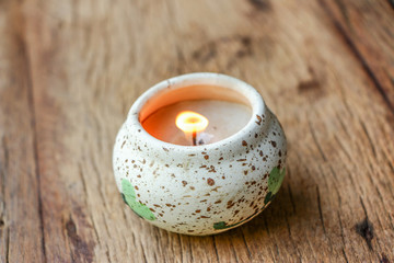 Obraz na płótnie Canvas Candle light fire on wooden table