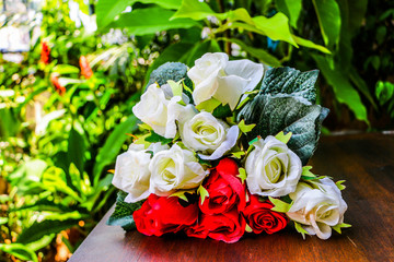 Beautiful rose flower bouquets  on wooden table