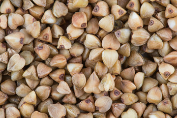 The buckwheat seeds` texture or background. The macro shot is made by means of stacking technology