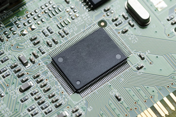 A microchip in the center of the printed circuit Board