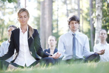 Business people practicing yoga