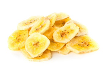 Heap of dried banana chips snack over white