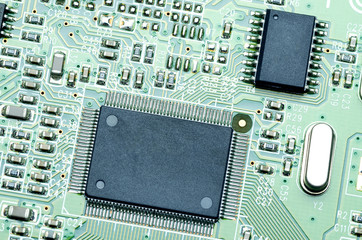 Chips and components on the green printed circuit Board